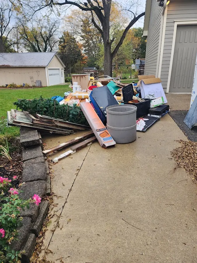 Dumpster being loaded with debris for Residential Dumpster Rental in Fairfield